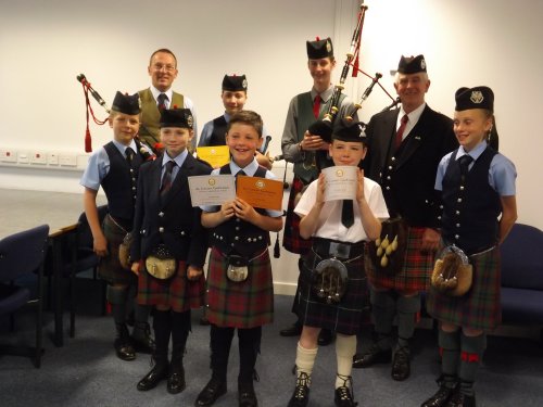 Some of our Junior piping competitors, with Pipe Major Alistair Duthie and piping adjudicator Tom Johnstone